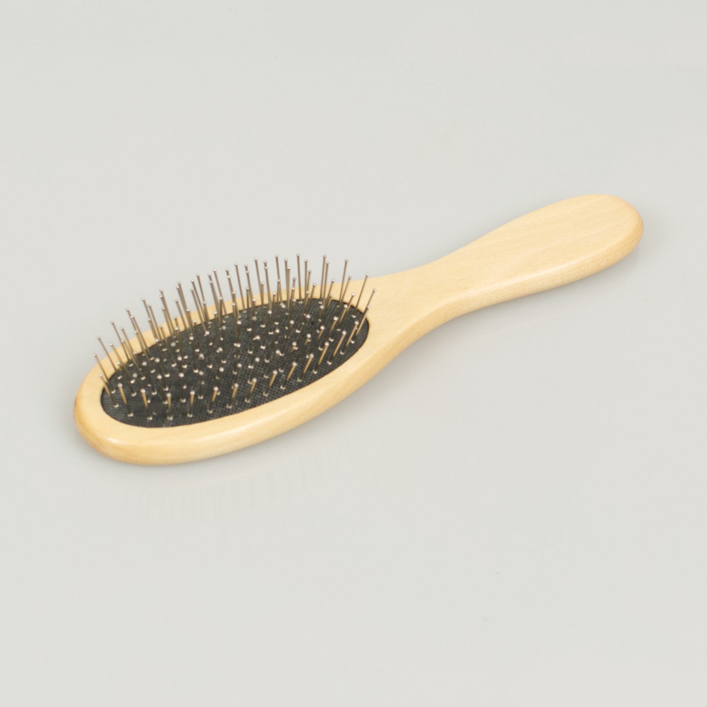 Mini travel size steel pin body control brush